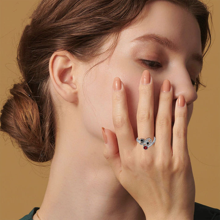 Adjustable Ring with Black Paw Print Design and Red Gemstone